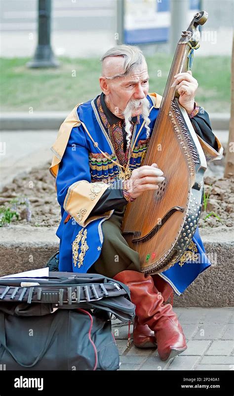 An Kobzar Singing To His Own Accompaniment On Bandura Instrument On