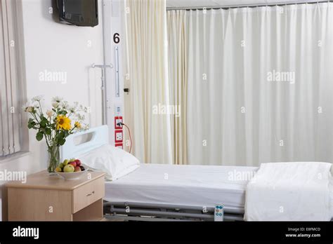 Empty Hospital Bed On Hospital Ward With Flowers Stock Photo Alamy