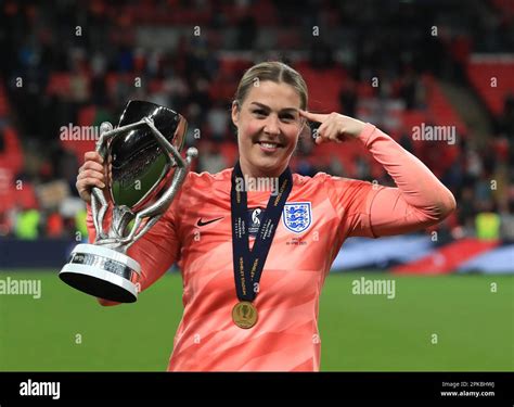 England Goalkeeper Mary Earps Celebrates With The Trophy Following The Womens Finalissima At