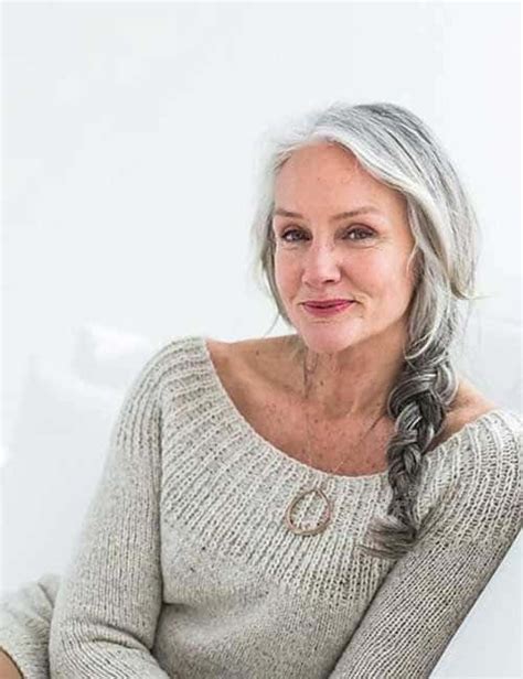 Slightly toss your bangs and hair on one side to create this long hairstyle for women over 50. 20 Best Long Hairstyles for 50 Year Old Women - SheIdeas