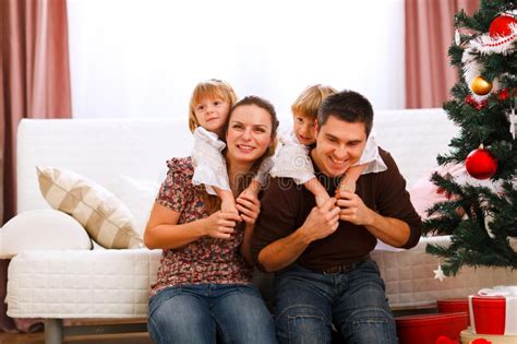 Happy Family Near Christmas Tree Stock Image - Image of female, dress