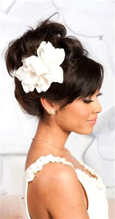 High Looped Updo With Bangs And Flower Wedding Hair