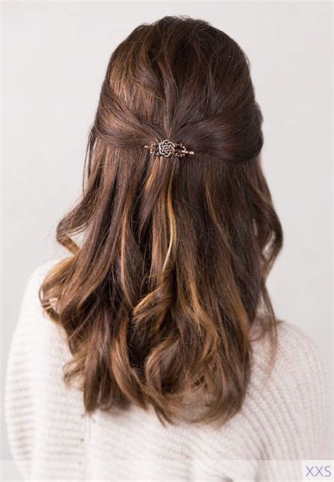 Curl your hair with an iron or hot rollers, and then gather a few crown locks to pull back. Pretty and simple!! Quick and easy half up half down ...