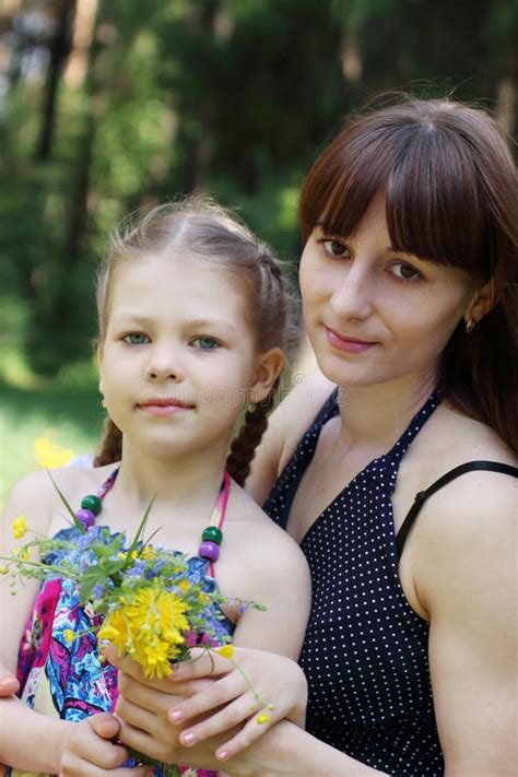 Happy Mother And Daughter Pose With Flowers Stock Image Image Of Person Flowers 78159487