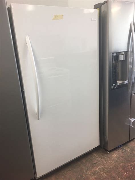 brand new scratch and dent frigidaire upright freezer with 1 year