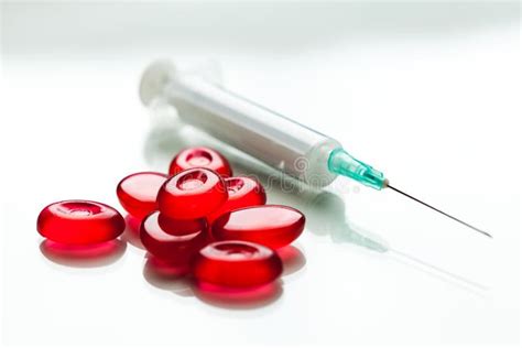 pile of red pills and syringe with needle stock image image of drug drop 203036763