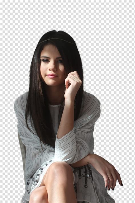 Free Download Selena Gomez Smiling Selena Gomez Sitting With Cross