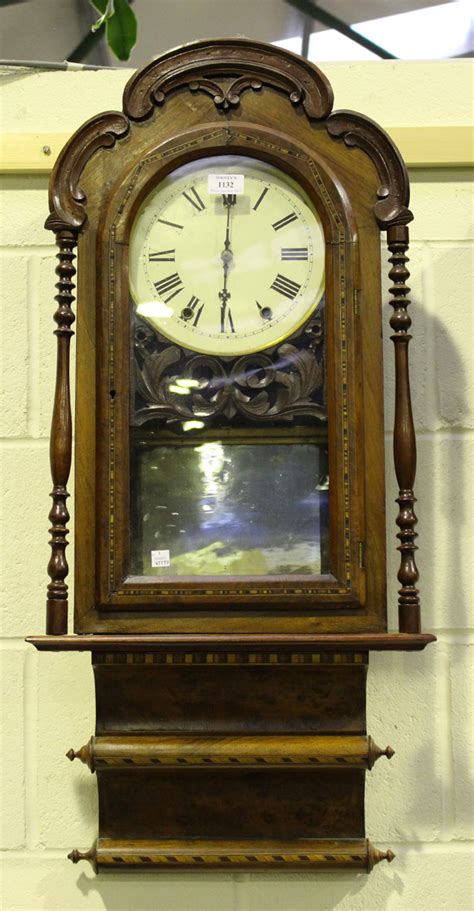 A Late 19th Century American Walnut Cased Wall Clock With Bell Strike