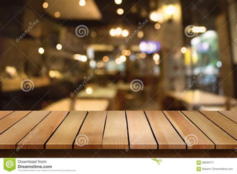 Wood Table Top On Blur Bokeh Cafe Background Can Be Used For Dis Stock