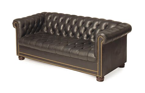 A Modern Black Leather Upholstered Button Tufted Chesterfield Style