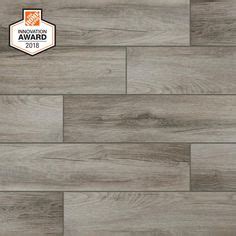 These wood textured tiles combine the authentic look of weathered wood in shades LifeProof Shadow Wood 6 in. x 24 in. Porcelain Floor and ...