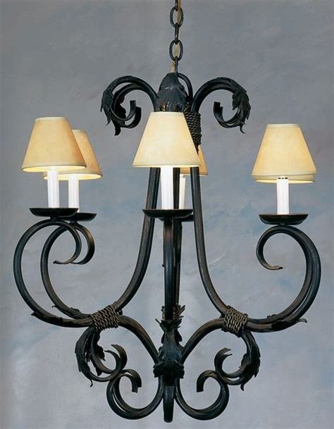 Something about the vintage, weathered look alludes to simpler times, but the crisp edges and bold lines with open frame bring us back to a more modern style. Wrought iron chandeliers by MRose Hoover on Lighting ...