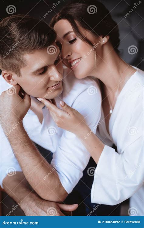 Portrait Of Beautiful Young Couple On Their Wedding Day Stock Photo