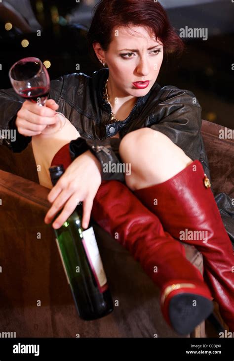 Tipsy Pretty Woman Holding Wine Glass And Bottle Stock Photo Alamy