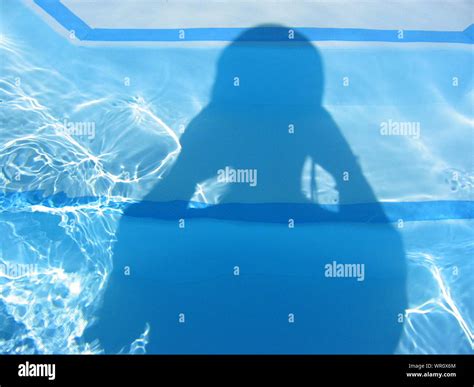 Shadow Of Person On Swimming Pool Stock Photo Alamy