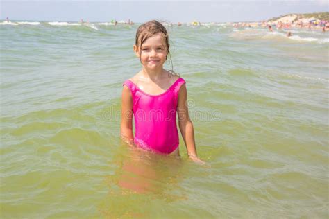 Six Year Old Girl Bathing In The Sea With His Mouth Open In Pleasure