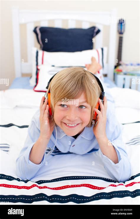 Relaxed Boy Listening Music Lying Down On Bed Stock Photo Alamy