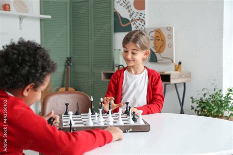 Cute Children Playing Chess At Home Stock Photo Adobe Stock