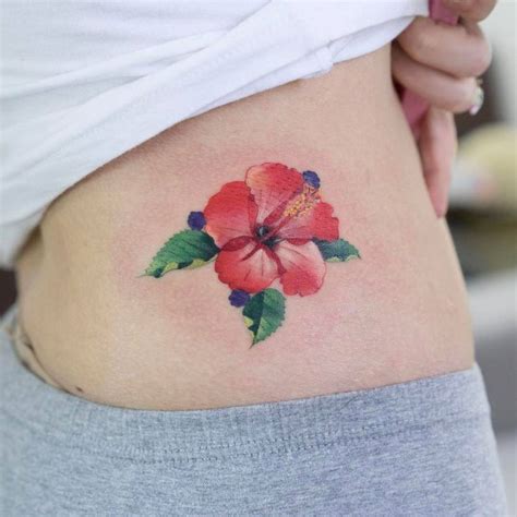 Red Hibiscus Flower Tattoo On The Hip