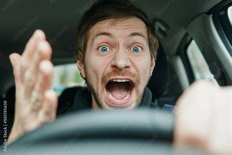 Angry Man Driving A Car Male Driver Gesturing And Shouting Behind The