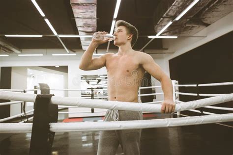 Male Boxer Drinking Water After Fight Or Workout Exercising In Boxing
