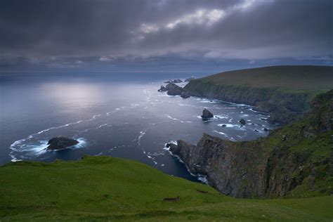 Aerial Photography Of Mountains Beside Body Of Water Landscape Coast