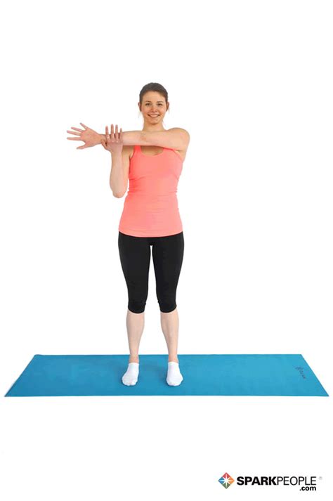 Standing Shoulder Stretch Exercise Demonstration Sparkpeople
