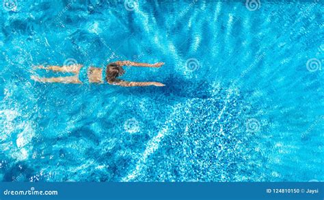 Aerial Top View Of Active Woman In Swimming Pool From Above Girl Swims In Blue Water Tropical
