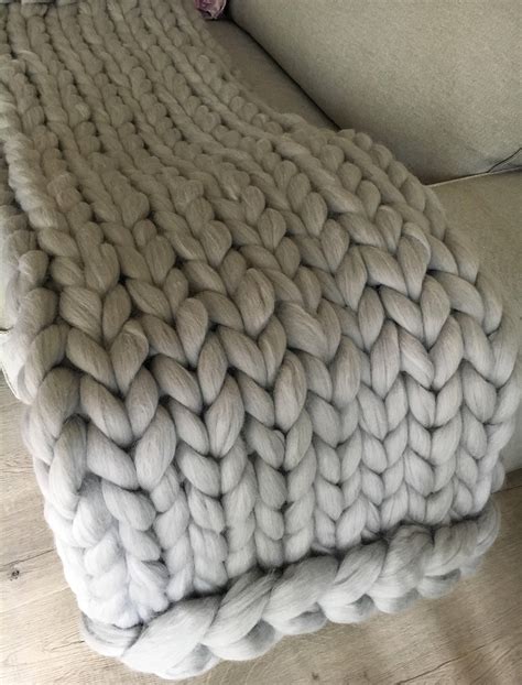 To use it as if it was giant sized yarn with needles (giant knitting) or their arms (arm knitting). Hand knit blanket Large cable knitted throw Chunky throw bed