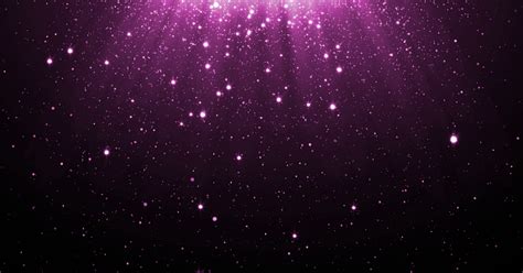 Abstract Purple Glitter Particles Background With Shining