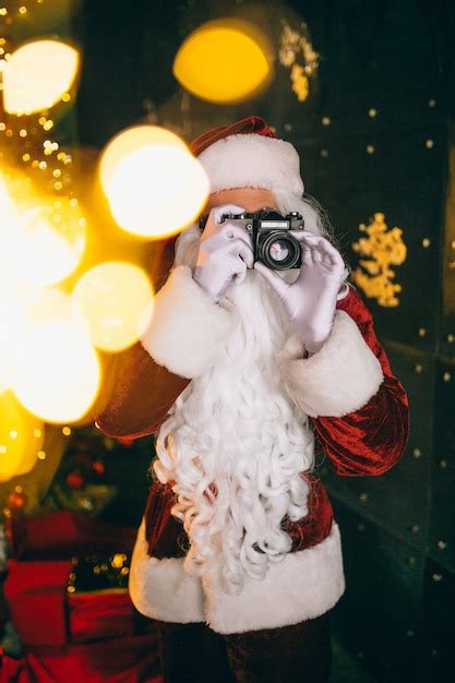 Free Photo Santa Claus Making Photos On Camera