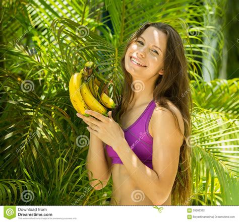 Woman With Bananas In Hands In Hat Exotic Fruits Lifestyle Pink Background Royalty Free Stock