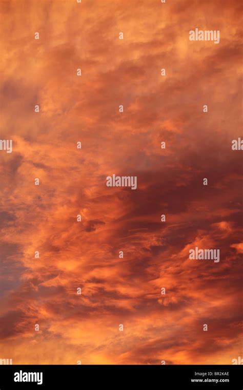 Brightly Colored Clouds At Sunset Stock Photo Alamy