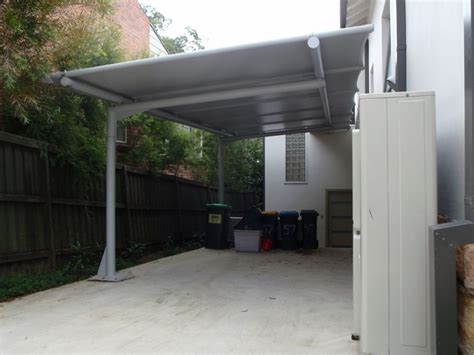 Upgrade to one of these for free: Cantilevered carport awning, with poles only one side ...