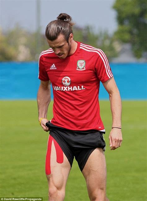gareth bale shows off his leg muscles with his upper leg partly covered by kinesio tape on