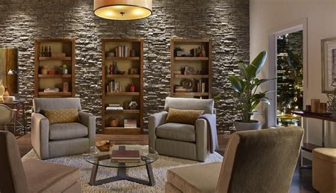 Contemporary Stone Wall Built In Bookcases Neutral Color Palette
