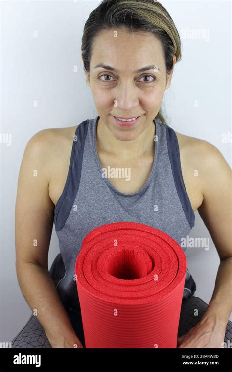 Beautiful Active Woman With Her Yoga Mat Stock Photo Alamy