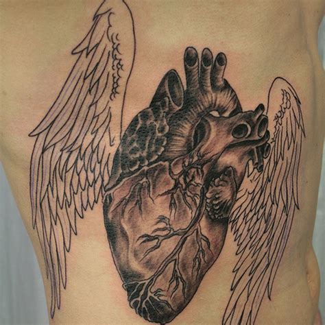 Heart Wings Tattoo On Rib Tattoo Designs Tattoo Pictures