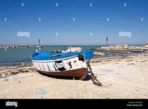 Little Blue Burnt Boat On The Beach Stock Photo Alamy