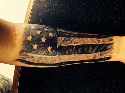 If you come from a military family, you might choose to honor your relatives with this inking. black and grey american flag forearm half sleeve - Tattoo.com
