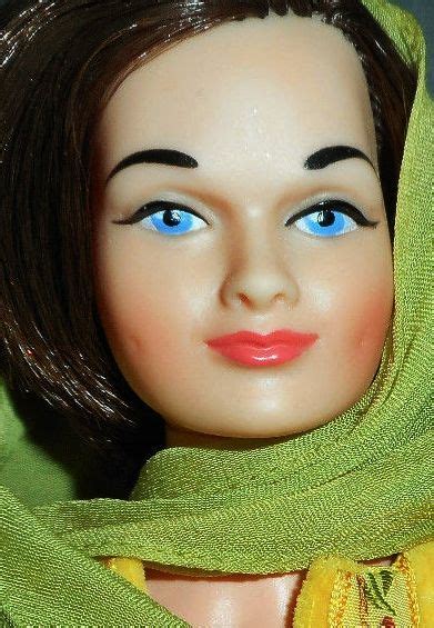 close up of the less than common blue eyed 13 vinyl judy littlechap doll wearing the