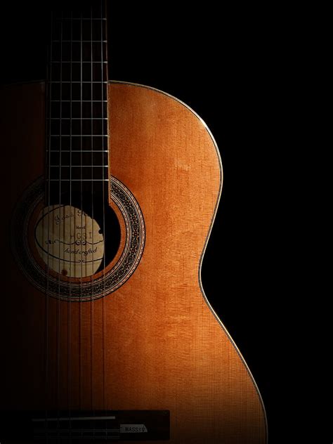 Royalty Free Photo Photography Of Brown Classical Guitar In Dark