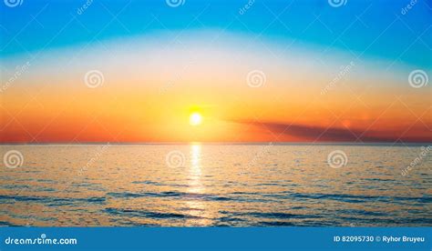 Sun Is Setting On Horizon At Sunset Sunrise Over Sea Or Ocean T Stock