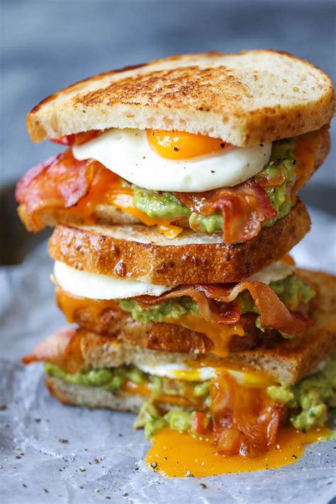 Ultimate Breakfast Sandwich Crispy Buttery Bread With Eggs Bacon Guacamole And Melted Cheese