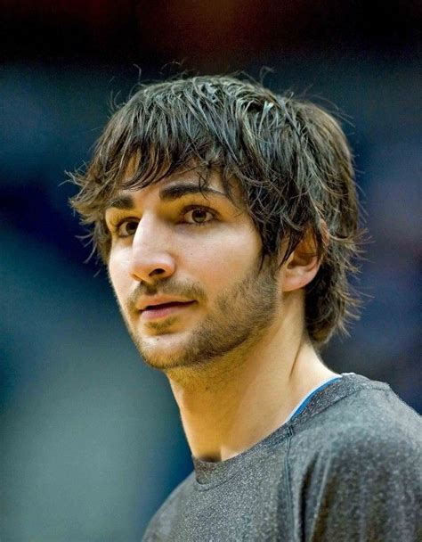 A Close Up Of A Person Wearing A T Shirt And Looking At The Camera