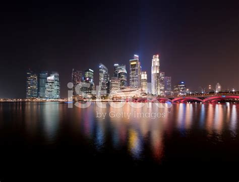 Singapore City Skyline And Marina Bay At Night Stock