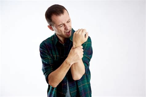 Premium Photo Man Sharp Pain In The Arm Elbow And Hand Poor Health