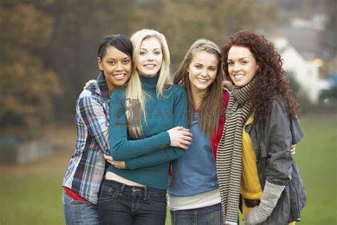 Group Of Four Teenage Girls In Autumn Landscape By Omgimages Vectors