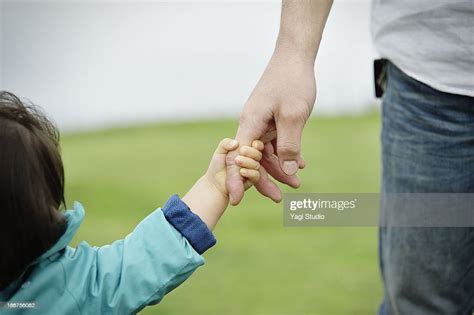 Father And Daughter Holding Hands Bildbanksbilder Getty Images