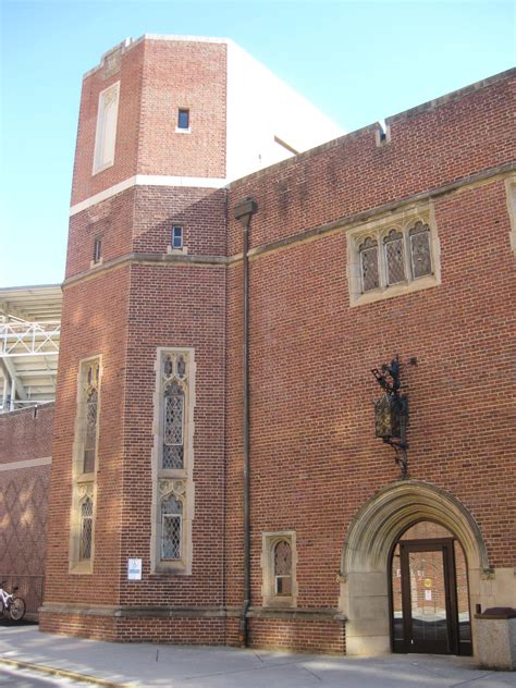A Large Brick Building With An Arched Doorway